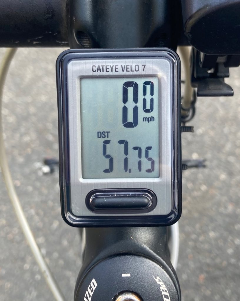 Odometer showing mileage of fifty-seven point seven five.