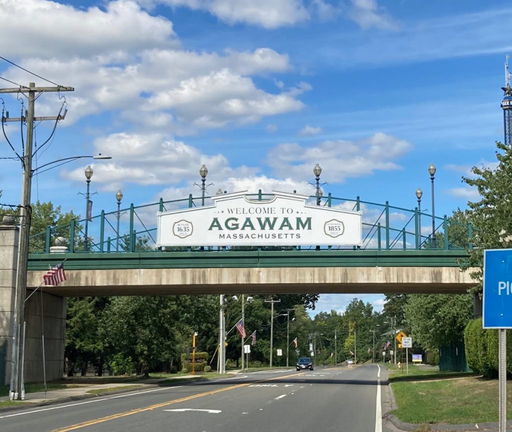 Sign on pedestrian bridge over road that reads "Welcome to Agawam Massachusetts"