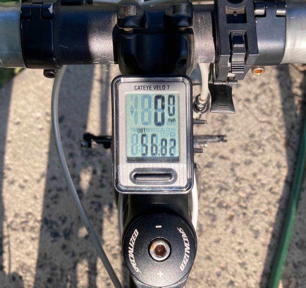 Bicycle odometer reading fifty-six point eight two miles.